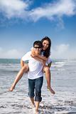 Asian Couple in love enjoy  summer holiday on the beach