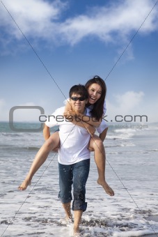 Asian Couple in love enjoy  summer holiday on the beach