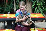 Young girl with a baby leopard