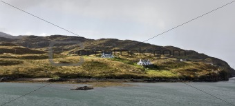 two remote houses at coastline