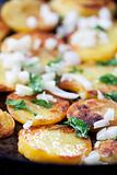 fried potatoes in an iron pan 