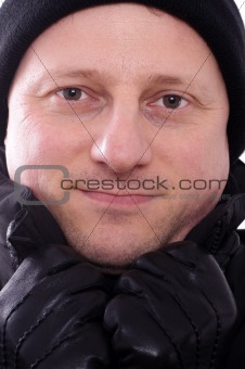 Man with bobble cap an gloves