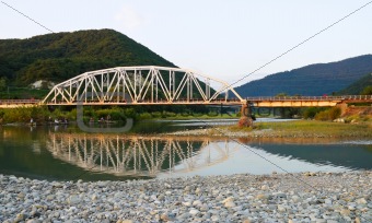 bridge through mountain river 
