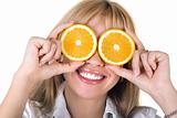 Portrait of the funny smiling girl with oranges. Isolated