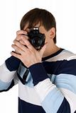 Young man with a camera. Isolated on white