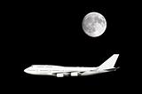 Jumbo jet under full moon
