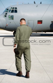 Pilot approaching military aircraft