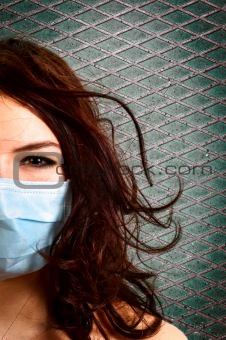 A girl in a protective mask against white isolated background