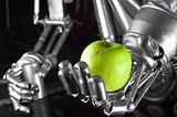 Robot hand holding green apple 