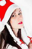 Girl in Santa's hat against white background