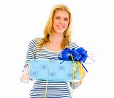 Portrait of beautiful teen girl with present box in hand
