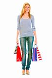 Full length portrait of teen girl with shopping bags
