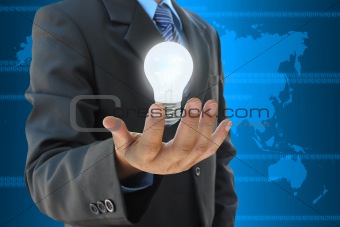 businessman hand holding light bulb