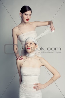 Two girls in bandages