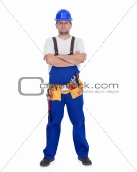 Confident repairman with lots of tools
