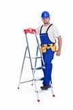 Handyman or worker leaning against ladder
