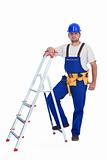 Confident handyman leaning on a ladder