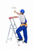 Handyman or worker painting with roller brush