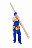 Handyman or worker carrying pipe