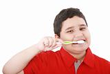 Beautiful boy brushing teeth, isolated on white 