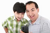 Young father and son was surprised, having read on mobile phone