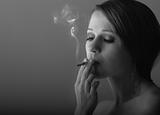 beautiful young woman smoking a cigarette 