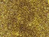 A macro close up of a gold glitter background.