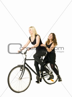 Two girls riding a bicycle