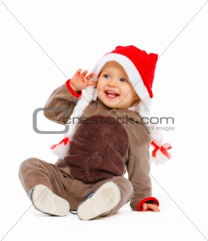 Portrait of smiling adorable baby in Santa hat

