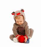 Portrait of adorable baby with Christmas toy
