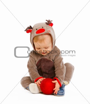 Portrait of adorable baby with Christmas toy
