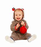 Portrait of happy lovely baby playing with Christmas ball
