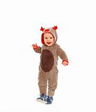 Happy baby in costume of Santa Claus's reindeer making step
