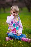 Little girl outdoors with imaginary binoculars
