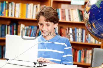 Boy Uses Computer in School