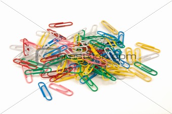 Bunch of colored paper clips on white