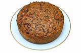 Home made fruit cake, isolated on a white background.
