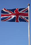 The Union Jack flag blowing in the wind on a sunny day