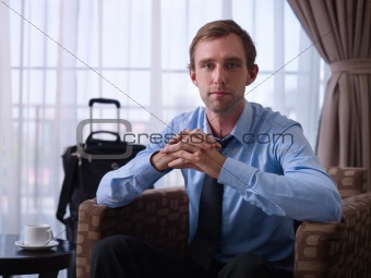 Portrait of happy manager smiling during business trip
