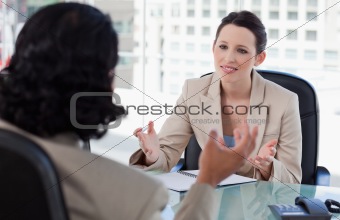 Smiling manager interviewing a male applicant