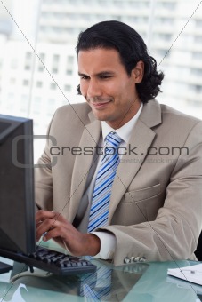 Portrait of a businessman working with a monitor