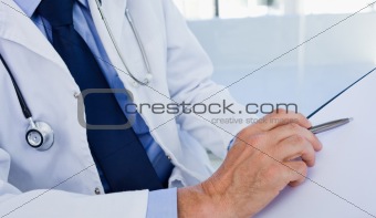 Close up of a doctor showing a document