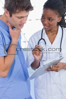 Portrait of doctors looking at a document