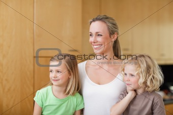 Side view of mother with daughter and son in the kitchen