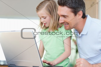 Father and daughter with notebook