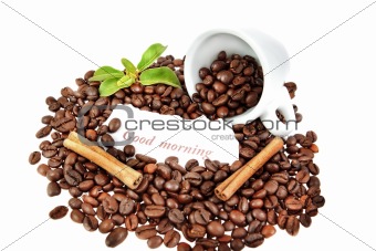 composition of a cup of coffee, cinnamon, and plants.