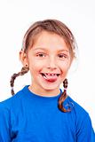 portrait of a little girl with braids sticking out her tongue - isolated on white