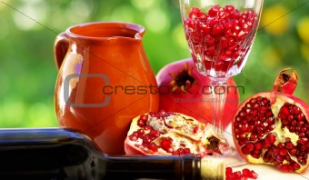 pomegranate and glass of red wine 