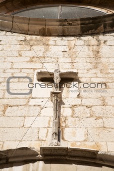 stone crucifix at church in Figueres