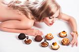 blond sexy girl eating pastry, she looks pastries